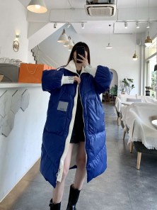 Длинный женский спортивный пуховик с полосками фото